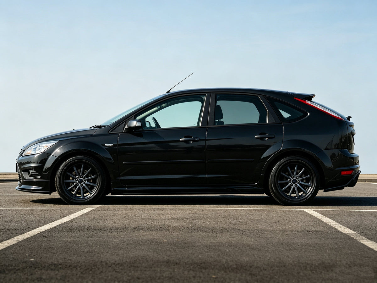 Lowered Ford Focus with VREL L1 coilovers parked in an open lot, side profile